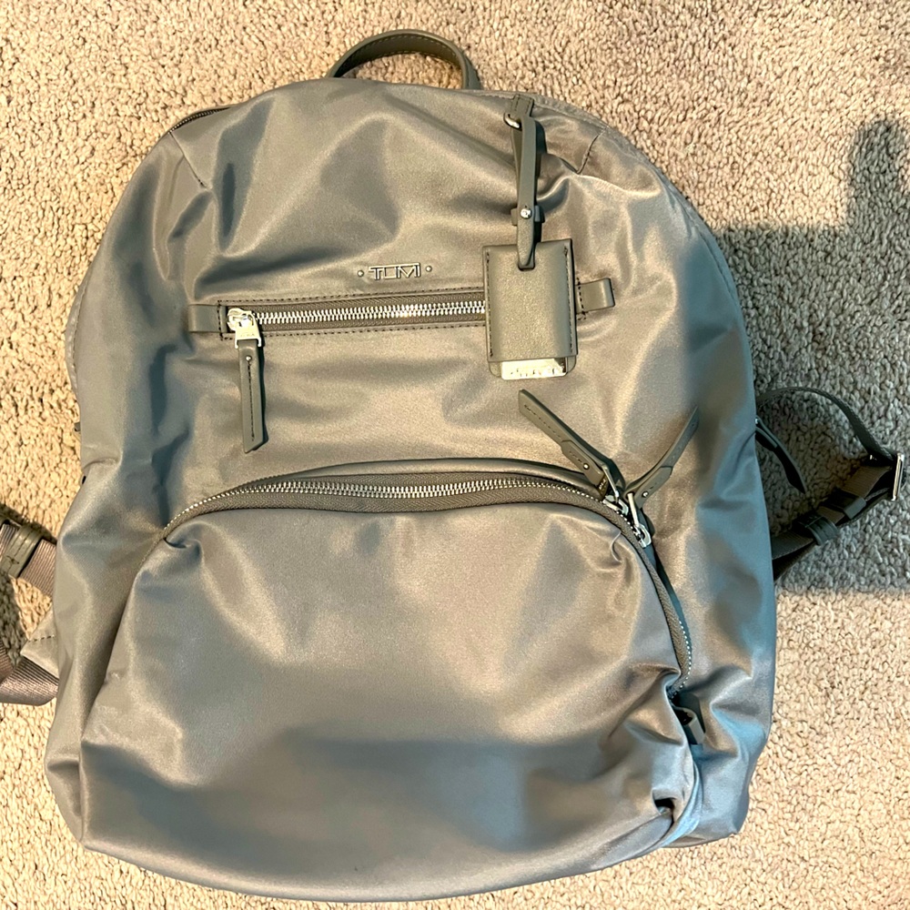 Silver Tumi Backpack.